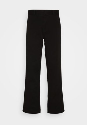 Pantalons évasés noirs en coton avec une texture lisse. Présentent un devant plat et une taille standard sans matériel visible.