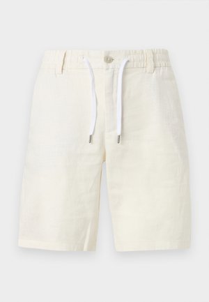 Krém színű, hétköznapi rövidnadrág elasztikus derékrésszel, gombos záródással, övbujtatókkal és fehér zsinórkötőkkel.