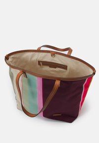 Striped canvas tote bag with leather handles, featuring colors like burgundy, pink, green, and cream. Includes an inner zip pocket.