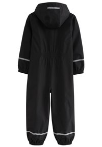 Black waterproof overall with a hood, elastic waistband, and reflective stripes on the sleeves and legs. Smooth texture, full-body coverage.
