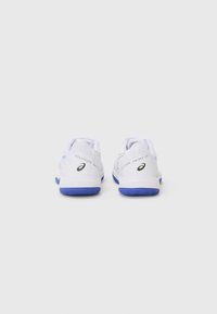 White athletic shoes with a breathable mesh upper, blue rubber sole, and printed logo. Features a sleek design and reinforced heel for support.
