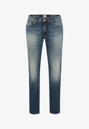 Jeans blu con una vestibilità affusolata, lavaggio medio, discreta scoloritura sulle cosce e design classico a cinque tasche. Presentano cuciture arancioni e chiusura a bottone.