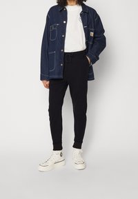 Nike Sportswear Träningsbyxor - black