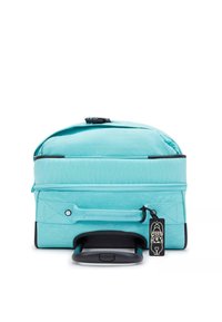 Teal rolling backpack with a rectangular shape, zippered compartments, black accents, and a retractable handle. Features a tag detail.