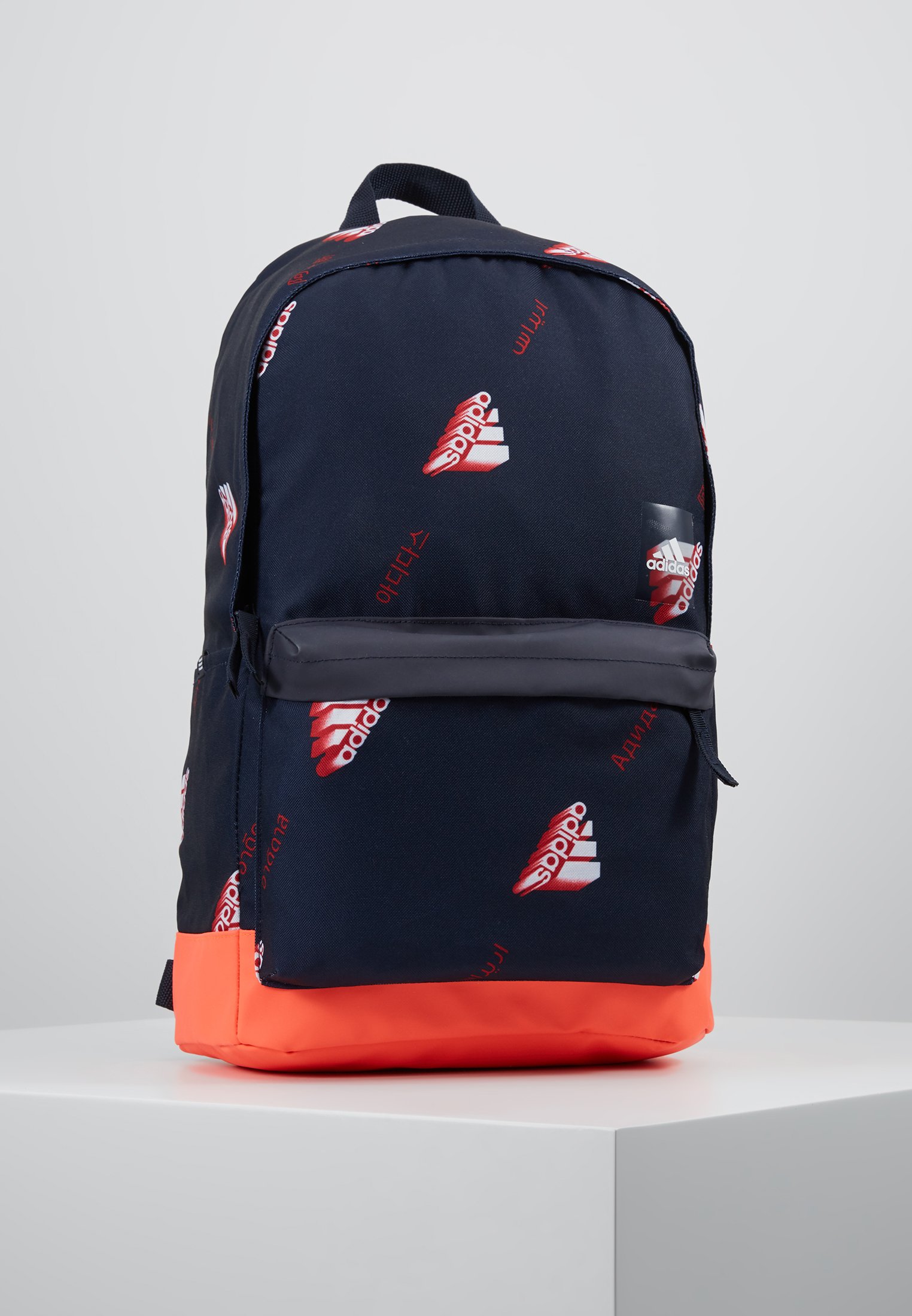 red and white adidas backpack