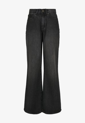 Kerge jalgadega mustad denim teksad kõrge vöökoha, viie tasku disaini ja pleekinud tekstuuriga. Omab nööbi ja tõmbluku sulgemist.