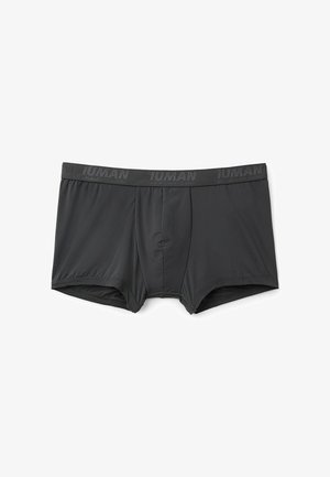 Zwarte boxershorts gemaakt van een gladde stof, met een comfortabele elastische tailleband voorzien van een reliëflogo en een gevormde pouch-ontwerp.