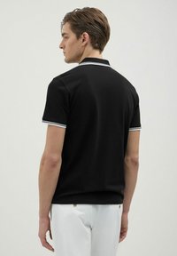 Calliope Polo - nero