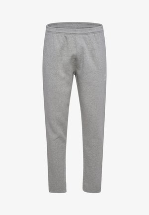 Lichtgrijze sweatpants van zacht, rekbaar materiaal. Heeft een elastische tailleband en een slim fit, met subtiele branding aan de zijkant.
