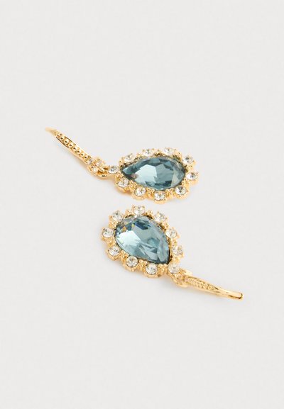 Gold-tone earrings with pear-shaped light blue gemstones surrounded by clear rhinestones, featuring a textured metal hook design.