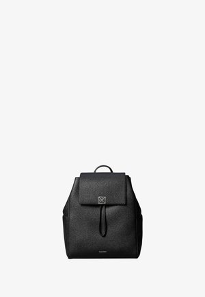Black leather backpack with flap and drawstring closure, top handle, and Calvin Klein logo on front.