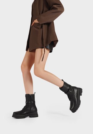 Stivaletti con plateau - nero