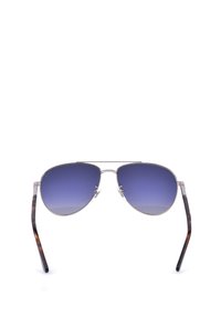 Lunettes de soleil aviateur avec monture en métal argenté, verres dégradés bleus et branches effilées à motif écaille.