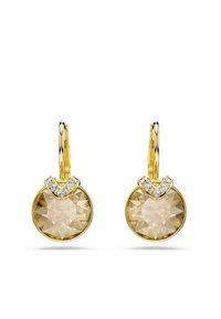Guld dråbeøreringe med store runde krystaller i champagnefarve og små klare krystaller arrangeret i en V-form øverst.