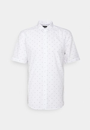 Chemise blanche à manches courtes avec un motif fin de petites formes rouges et noires. Fabriquée en tissu respirant.