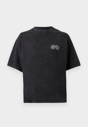 Black oversized t-shirt made from cotton with a crew neck. Features a white embroidered design on the left chest. Short sleeves.
