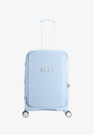 Light blue hard-shell suitcase with vertical ridges, telescopic handle, four spinner wheels, and "ELLE" logo on the front.