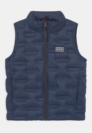 Veste sans manches matelassée bleu marine avec fermeture éclair sur le devant, col montant, poches latérales et petit patch logo rectangulaire sur la poitrine.