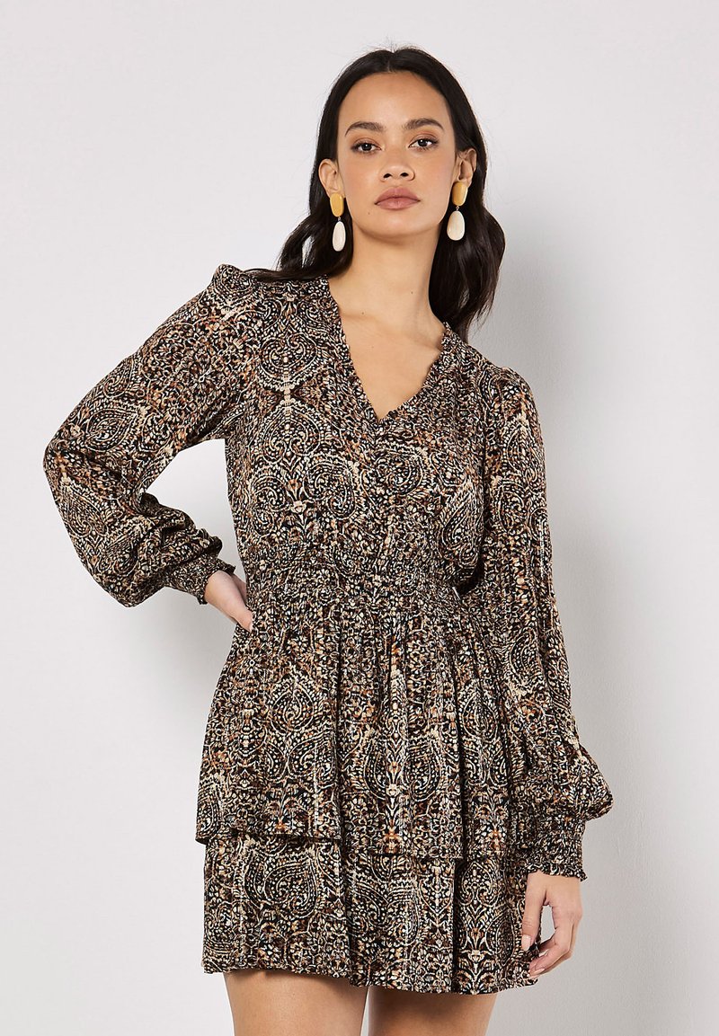 Long-sleeve dress with a V-neck, gathered waist, and layered skirt. Features a brown and beige paisley print and elasticized cuffs.