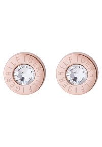 Pendientes circulares de oro rosa con una piedra preciosa clara en el centro y una marca grabada alrededor del borde. Superficie metálica lisa con un acabado pulido.