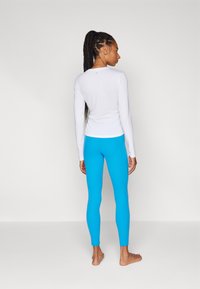 Athleta SALUTATION STASH 7/8 - Leggings - caribana blue