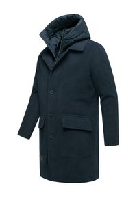 Tamno mornarski vuneni kaput s odvojivom podstavljenom kapuljačom, zatvaranjem na dugmad, dva prednja džepa i teksturiranim materijalom. Jednostavan, moderan dizajn.