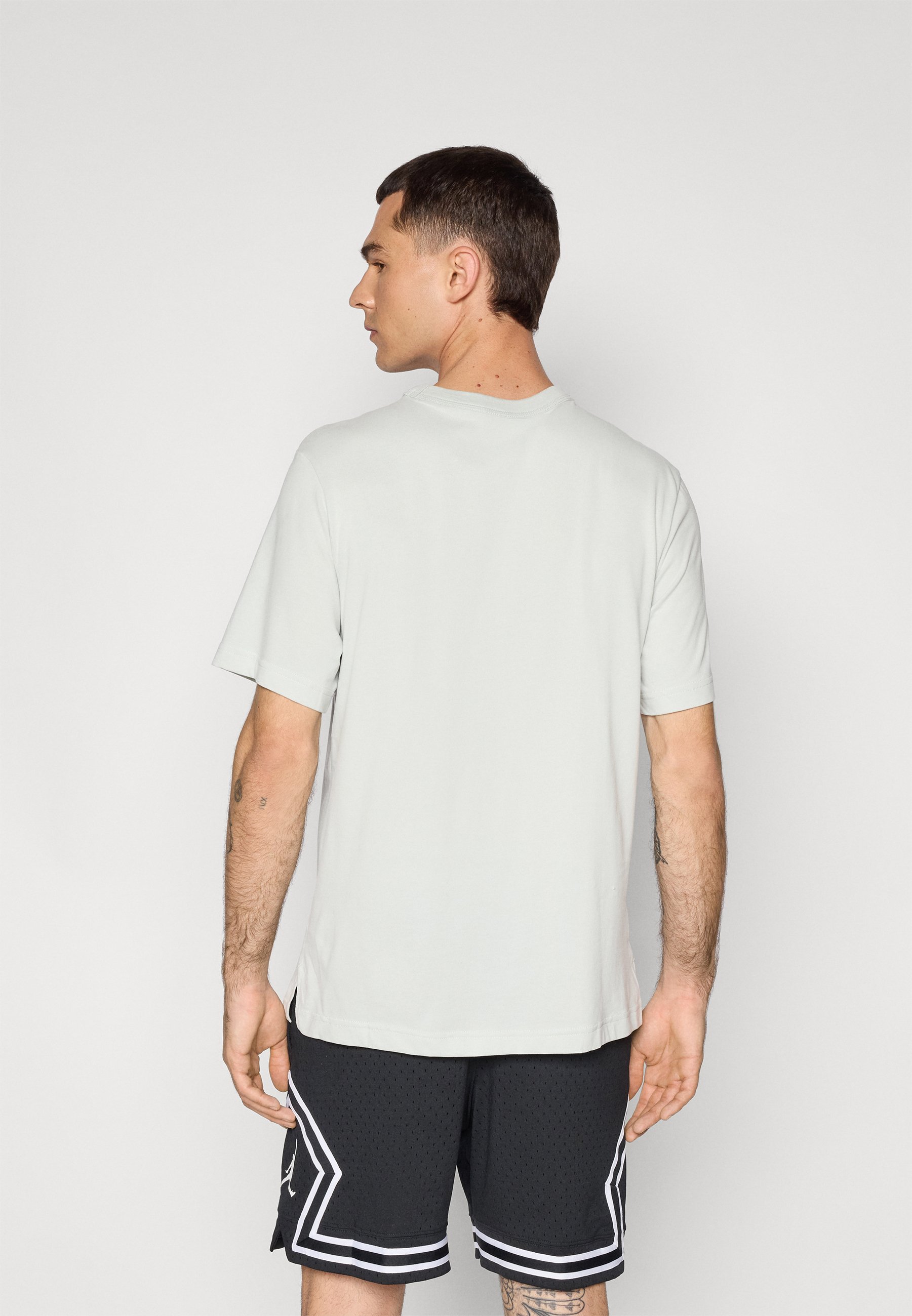 silver and black jordan shirt