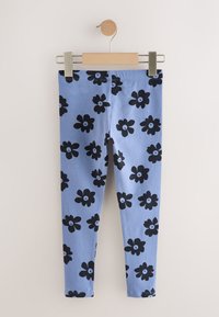 Kék leggings fekete virágos virágmintával. Puha anyagból készült, kényelmes, rugalmas derékpánttal.