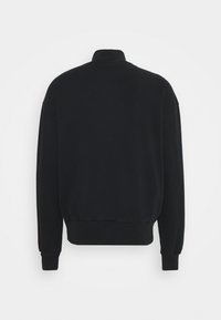Sweat-shirt noir à manches longues avec poignets, ceinture et col montant côtelés, montré de dos sur un fond uni.