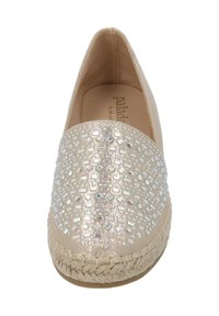 Beige espadrille with a flat shape, featuring a textured upper adorned with iridescent geometric cutouts and a woven jute sole.