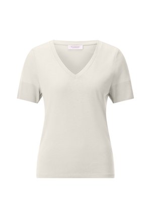 T-shirt beige clair à manches courtes avec col en V, poignets de manches côtelés et coupe slim, affichant une petite étiquette de marque à l'intérieur du col.
