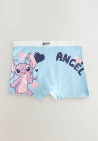 Boxers en coton bleu clair avec un personnage rose et violet portant des coeurs et le texte "ÁNCEL" en bleu foncé. Ceinture blanche.