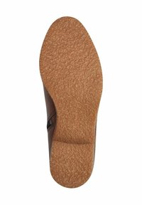 Schuhsohle mit strukturiertem, hellbraunem Gummiunterteil, sichtbare Größe 37 und partiellem Blick auf das dunkelbraune Lederobermaterial mit seitlichem Reißverschluss.