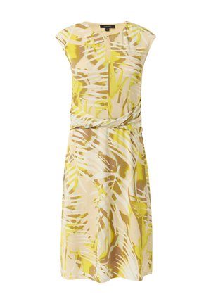 Knielanges Kleid aus leichtem Stoff mit einem gelb-beigen Palmblattmuster. Es hat einen runden Halsausschnitt und eine Drapierung an der Taille.