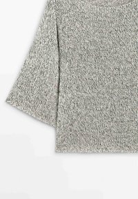 Light gray knitted sweater with black flecks, featuring a wide sleeve and ribbed hem, laid flat on a white background.