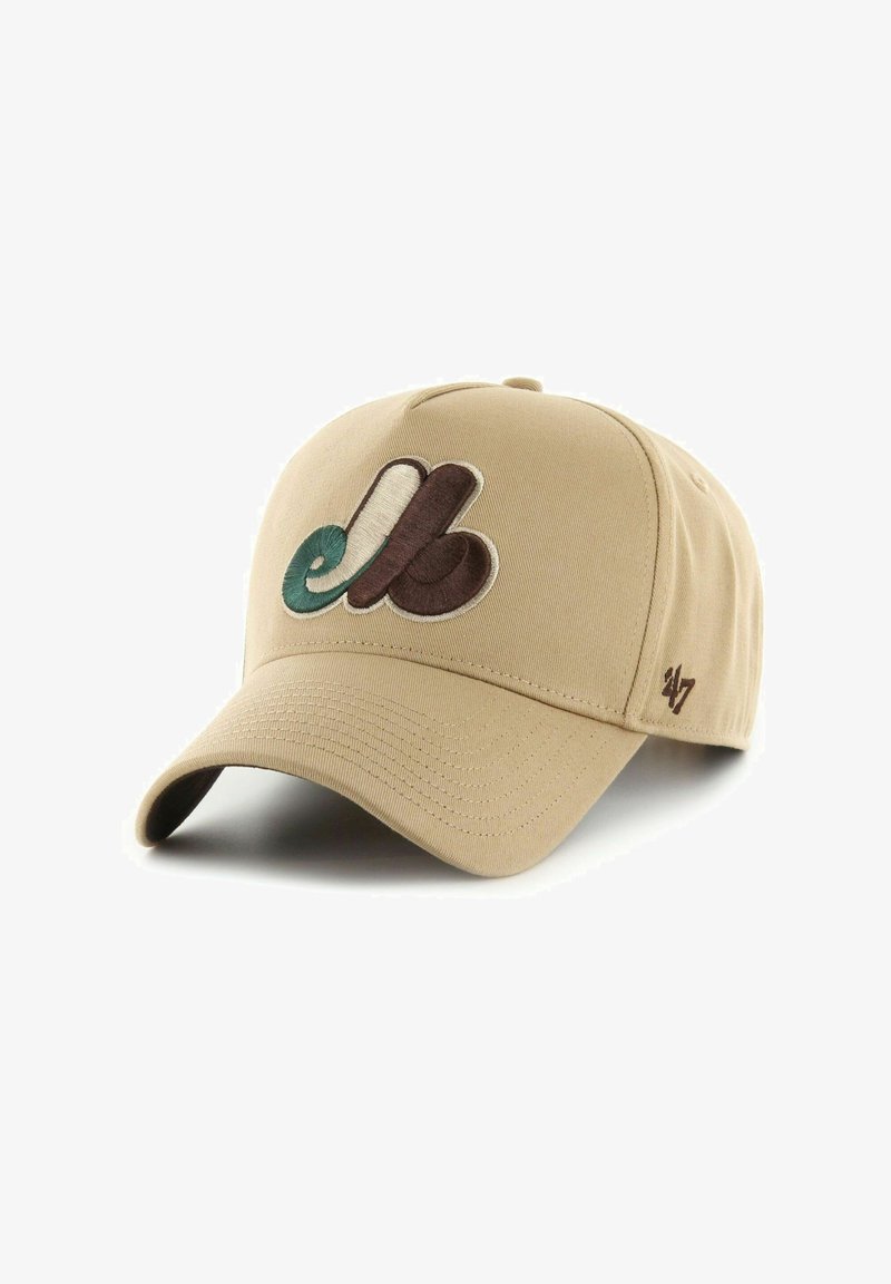 Beige baseball cap with embroidered multicolored logo. Features curved brim and textured fabric. Logo colors include dark brown, teal, and cream.