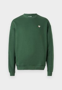 Felpa verde con colletto rotondo, maniche lunghe, polsini a coste e un piccolo logo ricamato sul petto, realizzata in tessuto morbido.