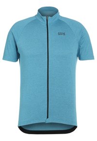 Cyklistický dres s krátkými rukávy v světle modré barvě, vyrobený z prodyšné látky s černým předním zipem a logem GORE v levé horní části.