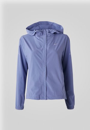 Light purple windbreaker jacket with a hood, a full front zipper, elastic cuffs, and a small silver Nike logo on the chest. Smooth texture.