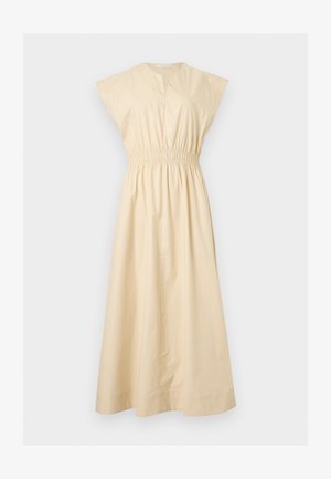 Robe maxi beige sans manches avec taille élastique, encolure en V et jupe ample en ligne A.