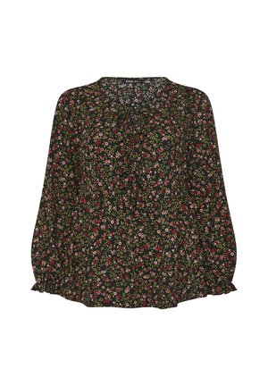 Blusa oscura de flores con un escote con volantes, mangas largas con puños elásticos y un corte holgado. Vibrantes flores rosas y verdes sobre un fondo negro.
