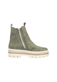 Bottines en cuir vert avec une fermeture éclair sur le côté, semelle épaisse blanche et accents marron. Elles présentent une texture lisse et un design à bout rond.
