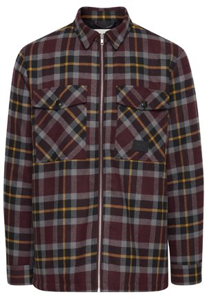 Burgundi, szürke és sárga kockás ing. Elöl cipzáros, két mellzsebe van fedővel, és puha anyagú textúrával rendelkezik.