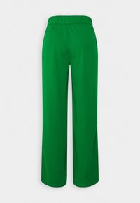 Pantalon vert, léger, à jambes larges avec une ceinture élastique et une texture lisse. Sans poches ni coutures visibles. Vue de dos.