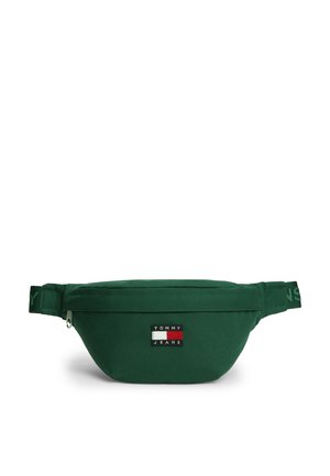 Ciemnozielona nerka z zamkiem błyskawicznym i naszywką z logo Tommy Jeans wyśrodkowaną z przodu. Regulowany pasek z markowym napisem po bokach.