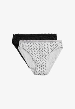 Dos pares de ropa interior de mujer. Uno negro con lunares blancos, el otro gris con un patrón de pequeñas gotas negras. Tela suave y elástica.
