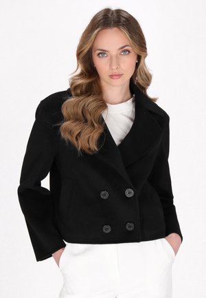 Schwarze doppelt knöpfbare Jacke aus strukturiertem Stoff, mit großen schwarzen Knöpfen, Reverskragen und Seitentaschen.