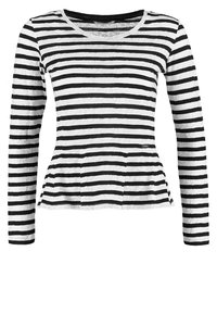 Haut à manches longues pour femmes, rayé horizontalement en noir et blanc, avec un col rond et un léger ourlet peplum.