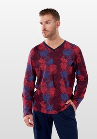 Langärmliges V-Ausschnitt-Shirt in Dunkelrot mit blauen Blumenmuster. Hergestellt aus weichem Stoff, mit lockerer Passform und einfarbigen marineblauen Akzenten.