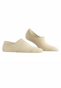 Chaussettes beige à coupe basse en tissu doux et extensible, avec une texture lisse, des détails de couture subtils et un design de orteil arrondi.